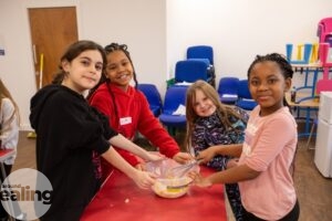Young girls taking part in the HAF programme baking activity