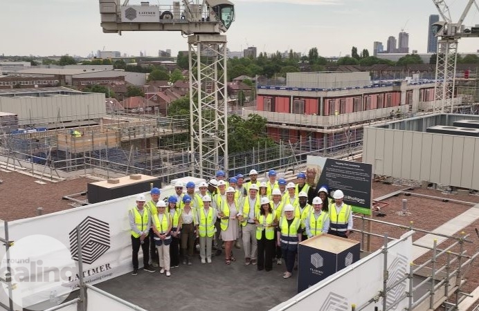 Group of people standing at the top of a building at Twyford Abbey