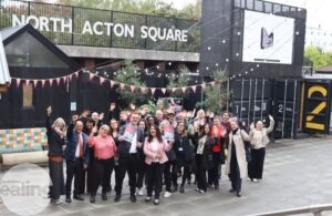 Group of people at North Acton Square celebrating the Living Wage Zone