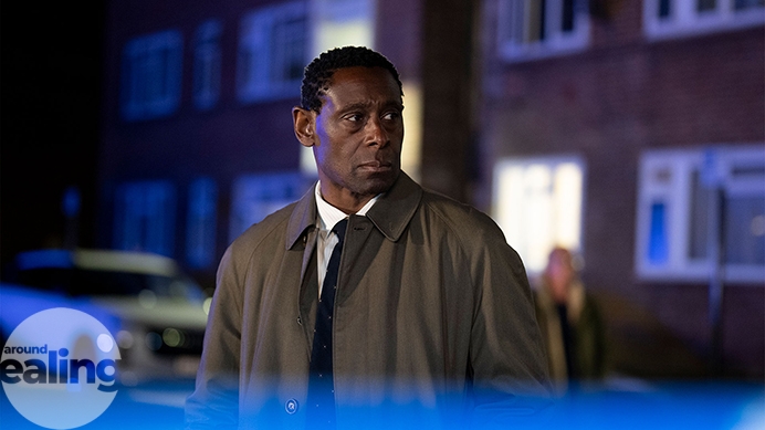 Actor David Harewood in TV series Pierre. Standing in a street at nighttime. Photo courtesy of Channel 4