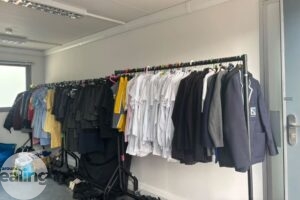 Standing clothes rails with uniform hanging up
