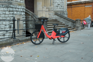 Voi branded e-bike on a pavement